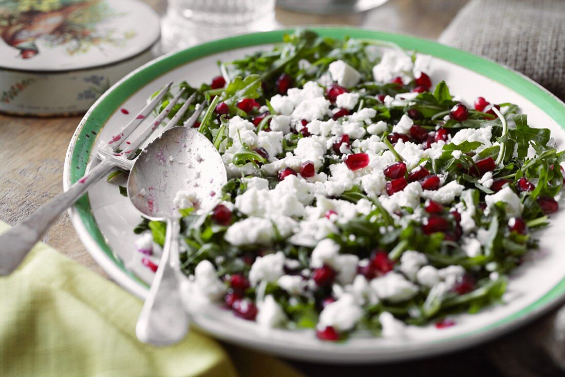 Rocket salad with pomegranate seeds and feta
