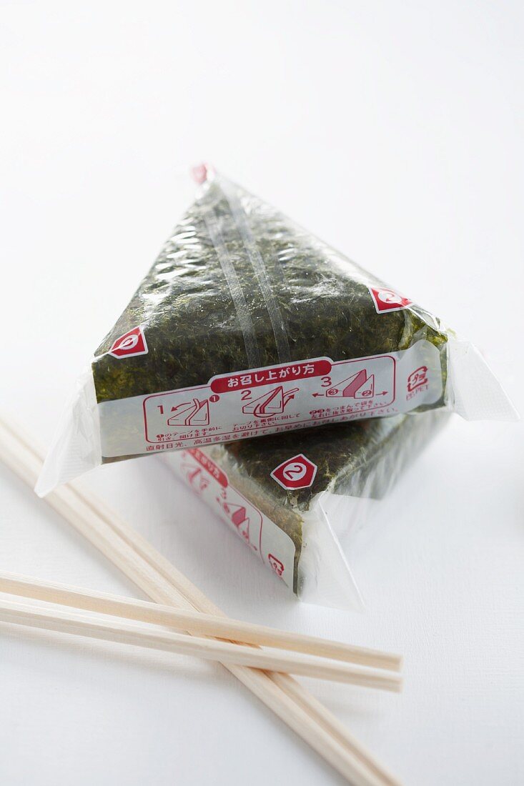 Onigiri wrapped in sheets of nori (spiced rice balls, Japan) in packaging