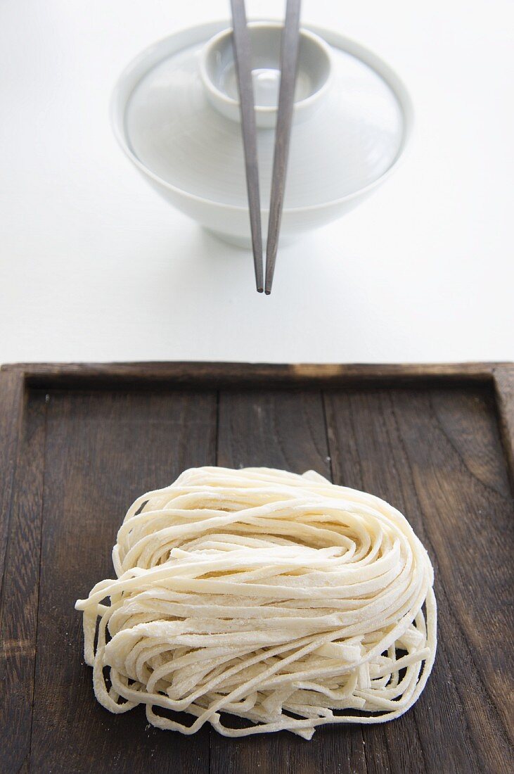 Soba noodles and an eating bowl with chopsticks (Japan)