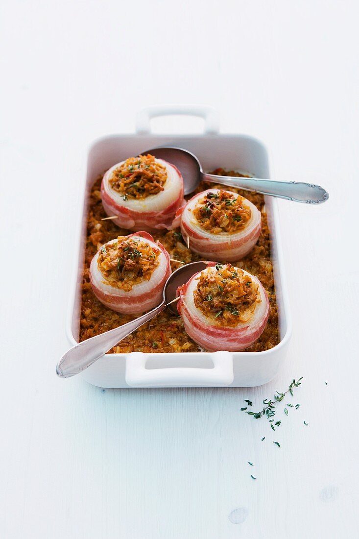 Stuffed white onions wrapped in bacon