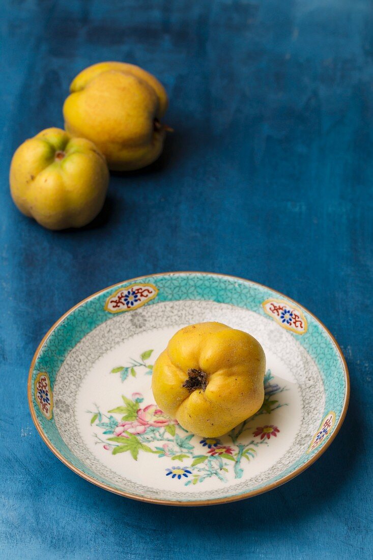 Quinces on a plate and to one side