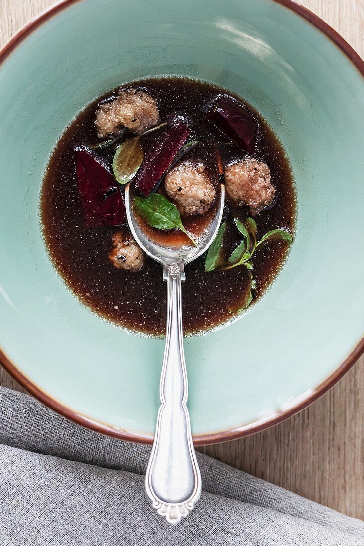 Mushroom bouillon with calf's sweetbreads and beetroot