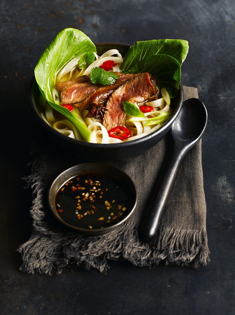 Noodle soup with beef and pak choi (Vietnam)