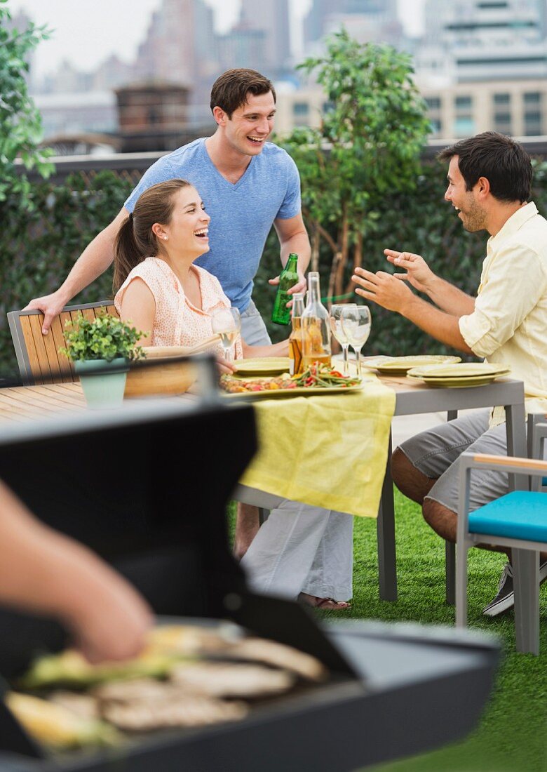 Friends enjoying a barbeque in the garden