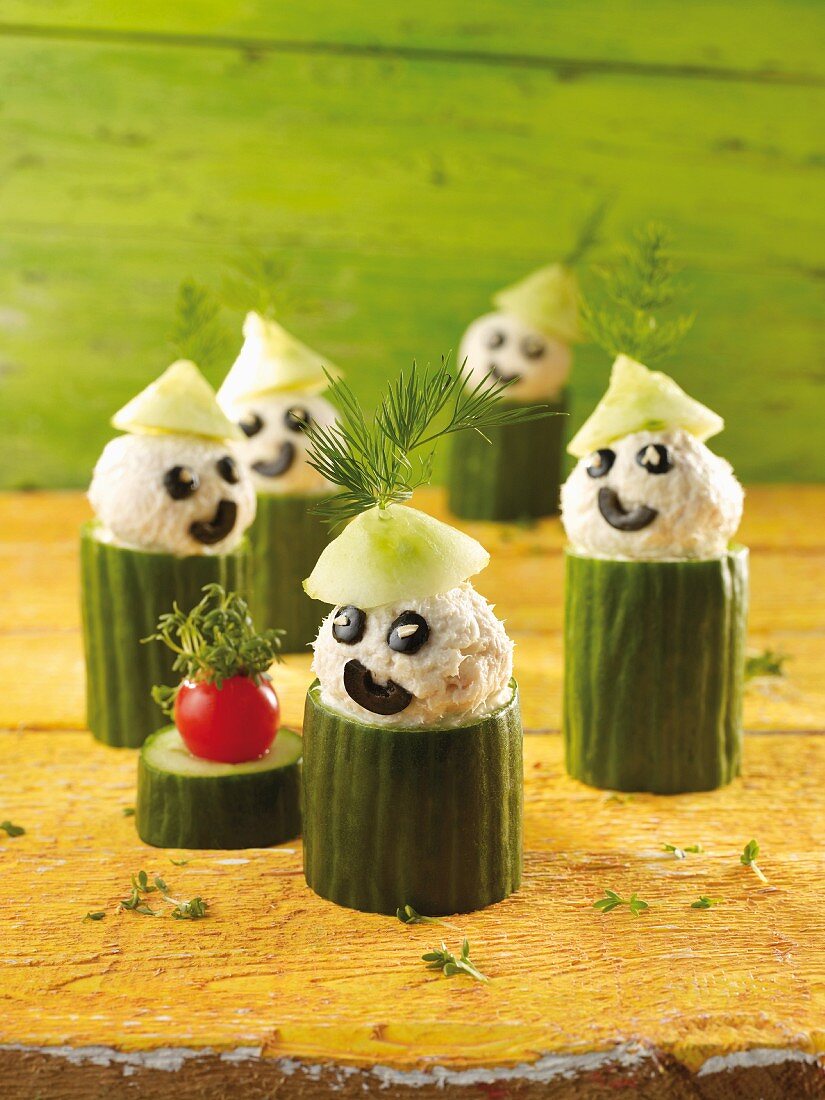 Little cucumber people with olives