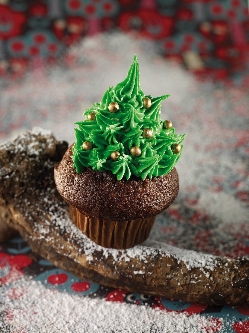 A Christmas cupcake with green icing