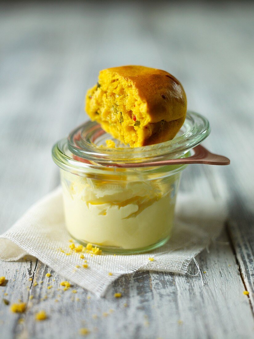 Squash scone on top of a jar of butter