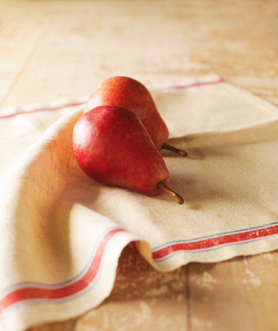 Two Red Pears on a Linen Towel