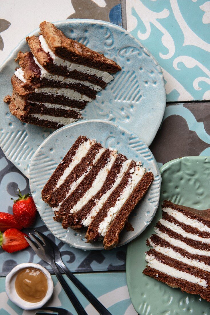 Chocolate layer cake with strawberries and caramel sauce