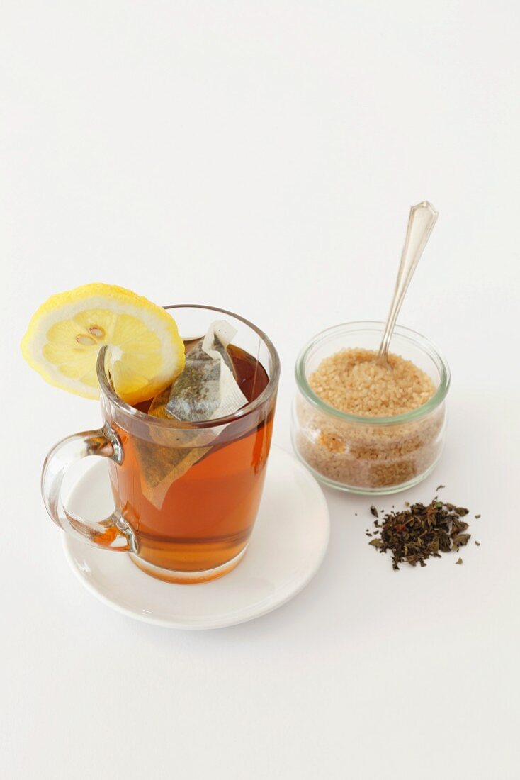 Peppermint tea with tea leaves and lemon