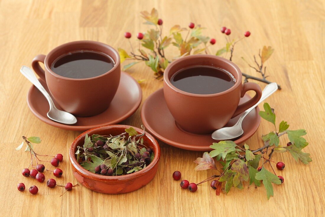 Hawthorn tea with tea leaves and berries