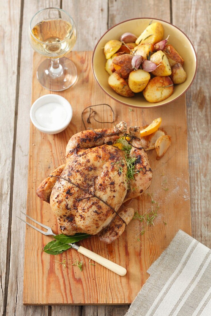Lemon chicken with thyme and garlic potatoes