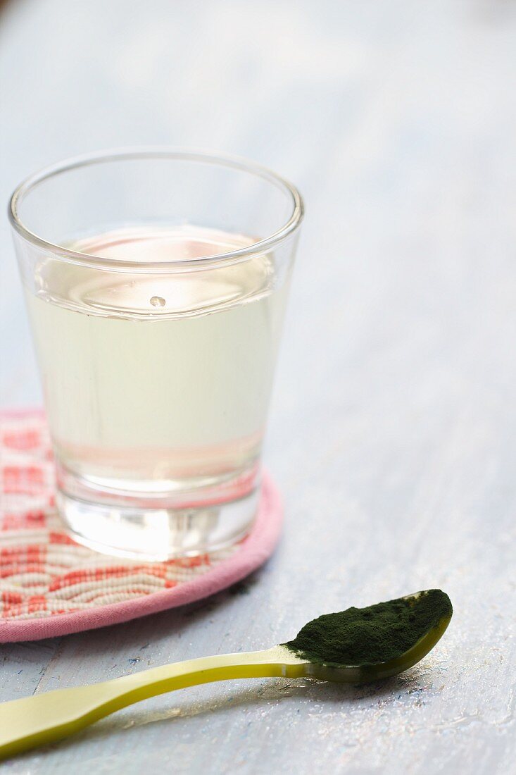 Coconut water and a spoonful of chlorella (algae)