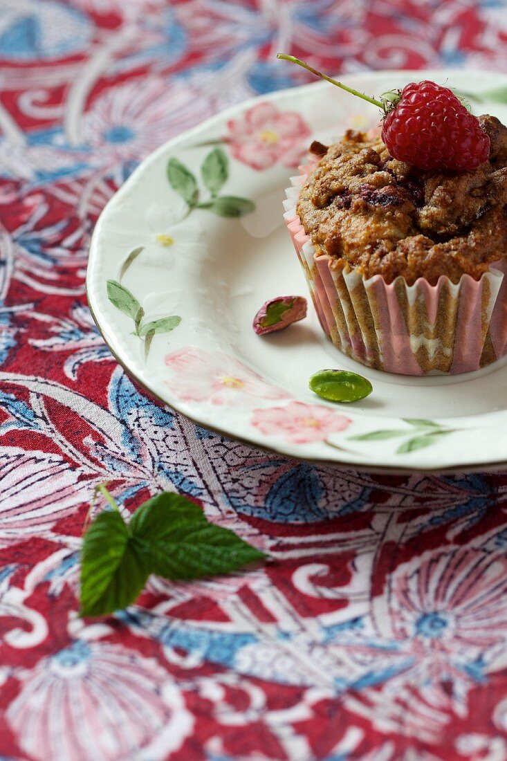 A raspberry and pistachio muffin