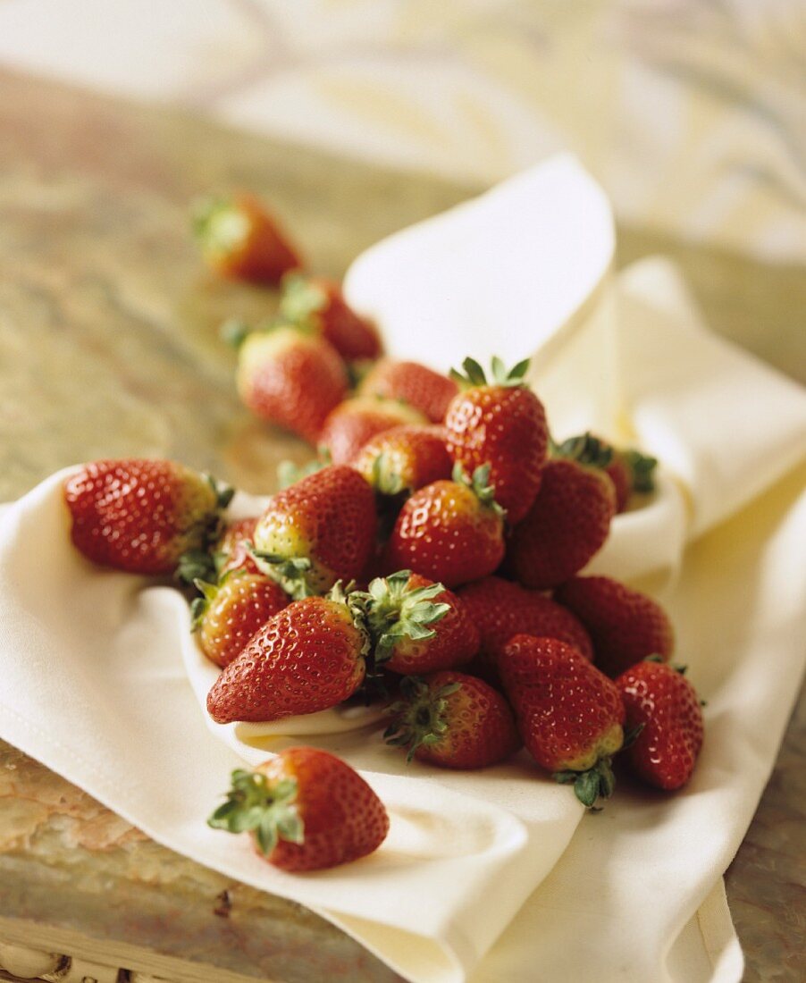 Fresh strawberries on a white napkin