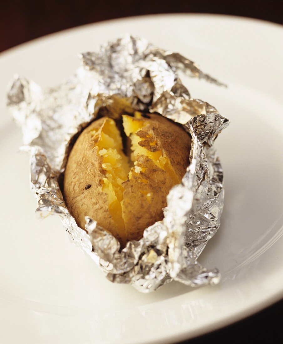 A baked potato in aluminium foil