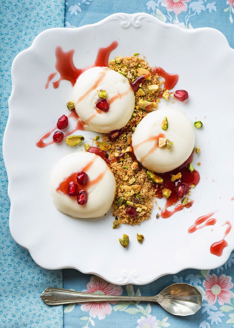 Panna cotta with pistachios and pomegranate seeds