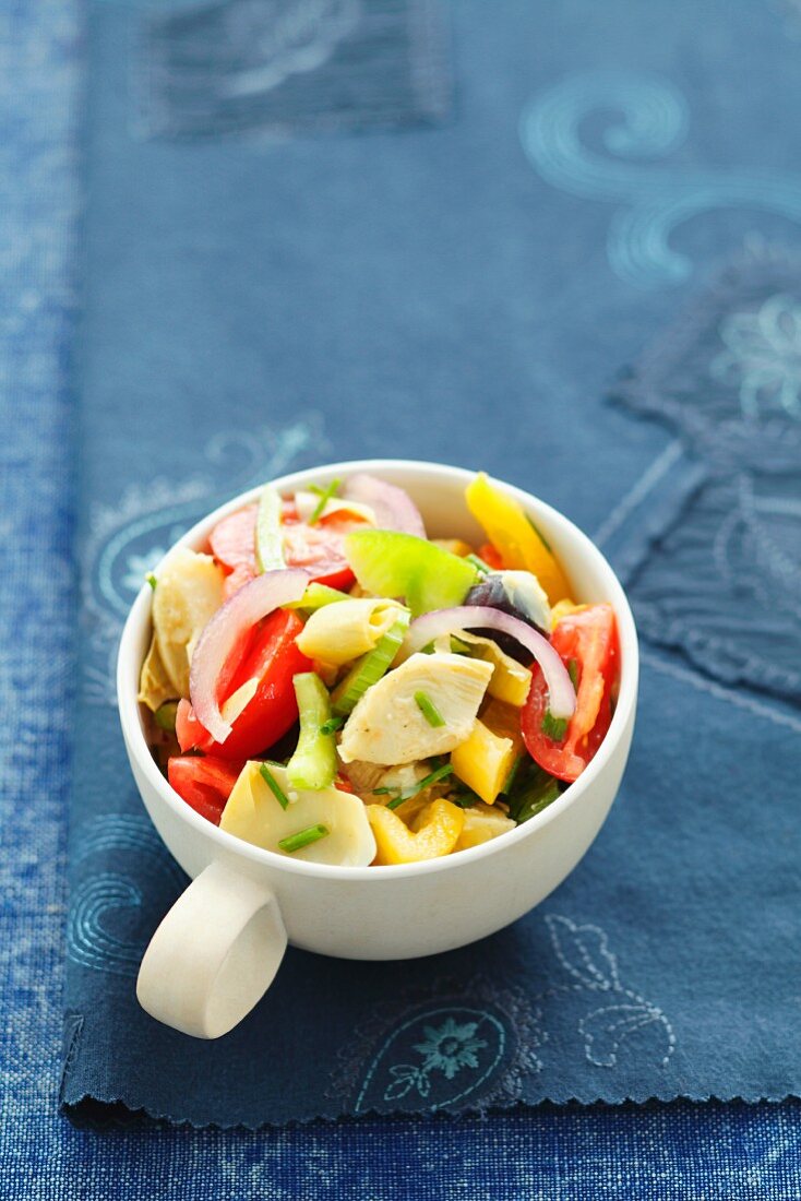 Vegetable salad with artichoke hearts, peppers, tomatoes and onions