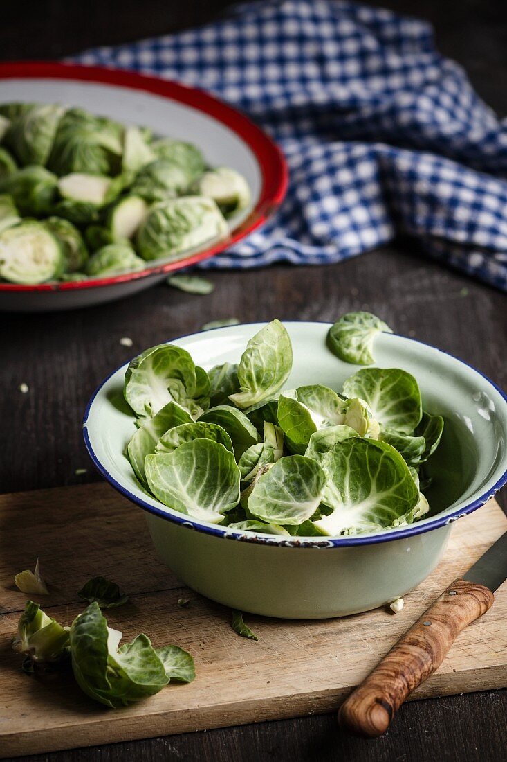 Brussel sprout leaves in an enamel bowl