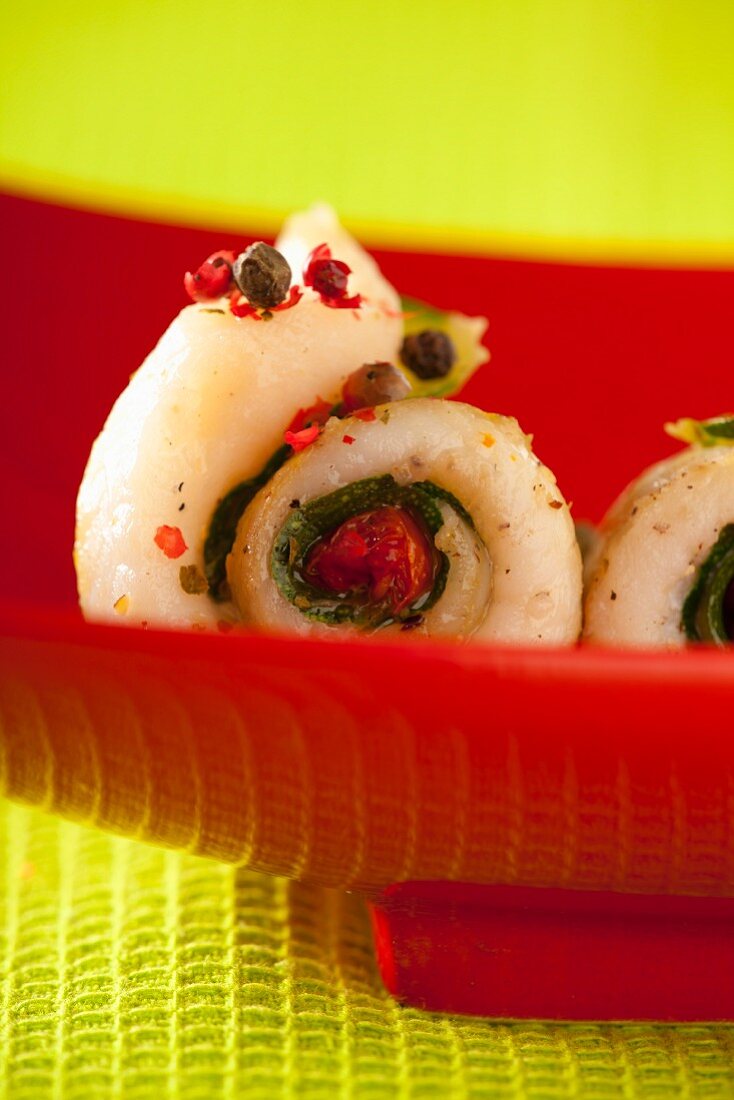 Fish and courgette rolls with cranberries and peppercorns