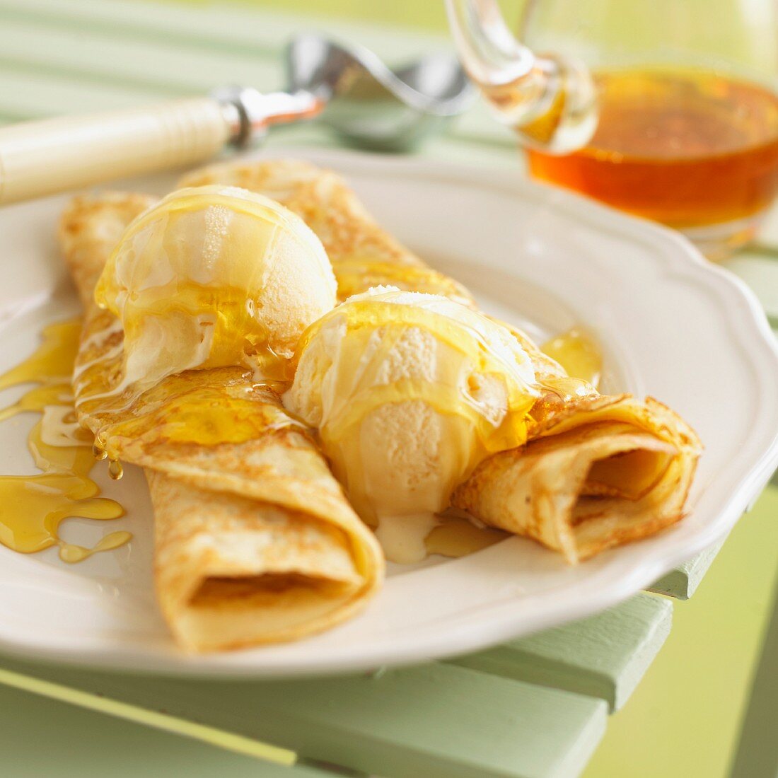 Crepes with vanilla ice cream and maple syrup