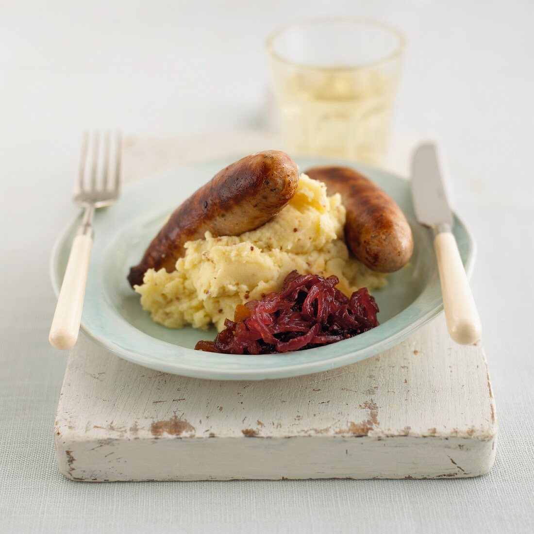 Bratwurst with mashed potatoes and onion relish