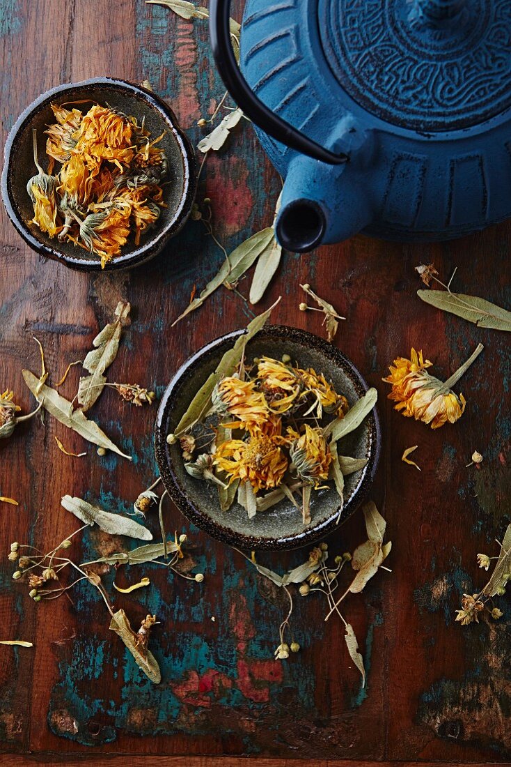 dried marigold, lime flowers and a cast iron tea pot