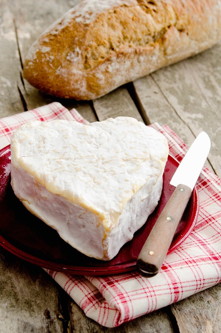 A heart-shaped Neufchatel cheese with bread