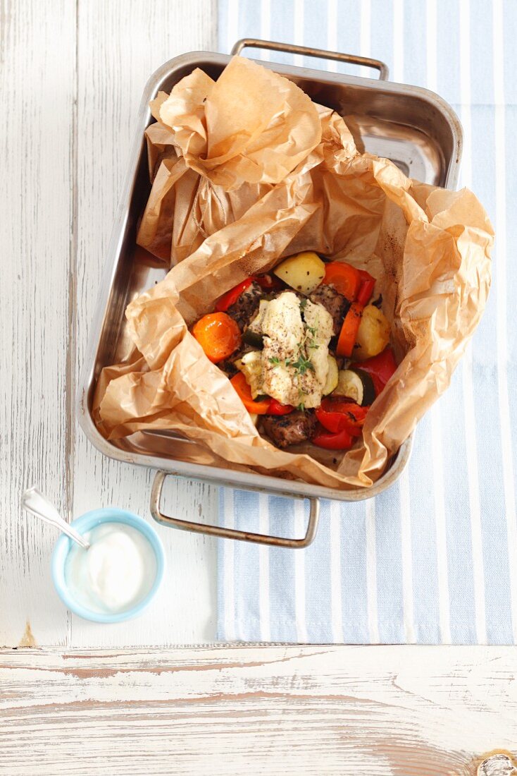 Kleftiko with pork, vegetables and ewe's cheese, in baking parchment