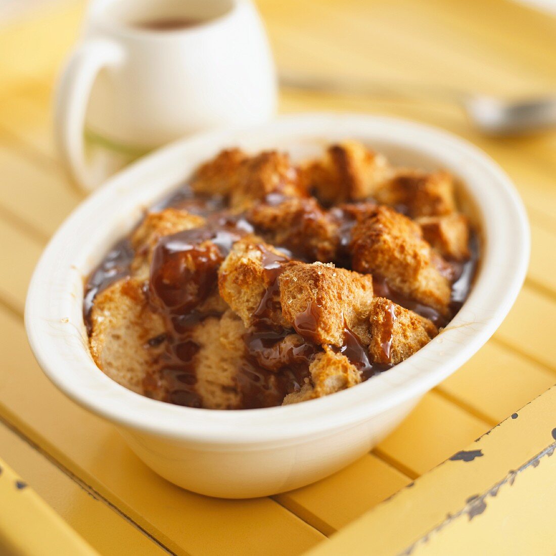 Bread and butter pudding with chocolate sauce