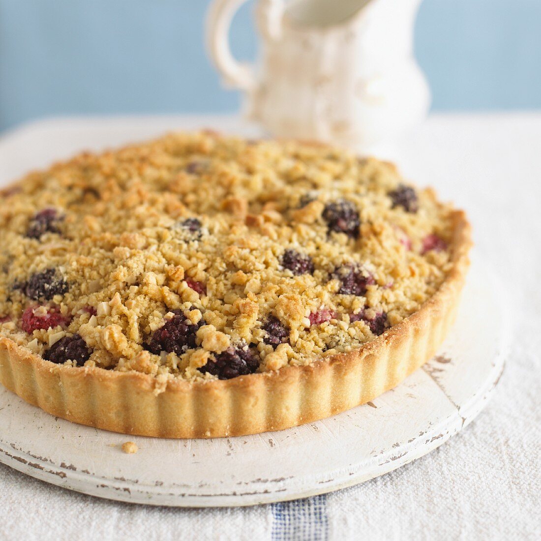 A whole boysenberry-apple tart with streusel topping