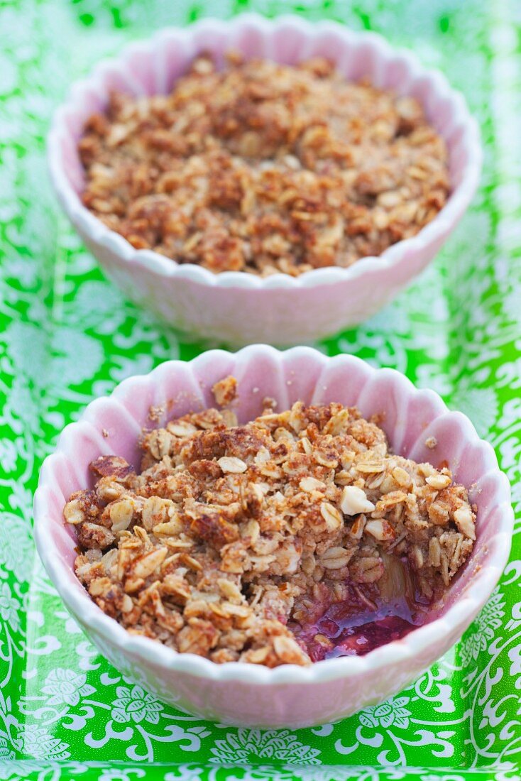 Two bowls of strawberry-rhubarb crumble