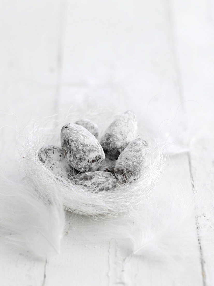 Chocolate eggs in a white Easter nest