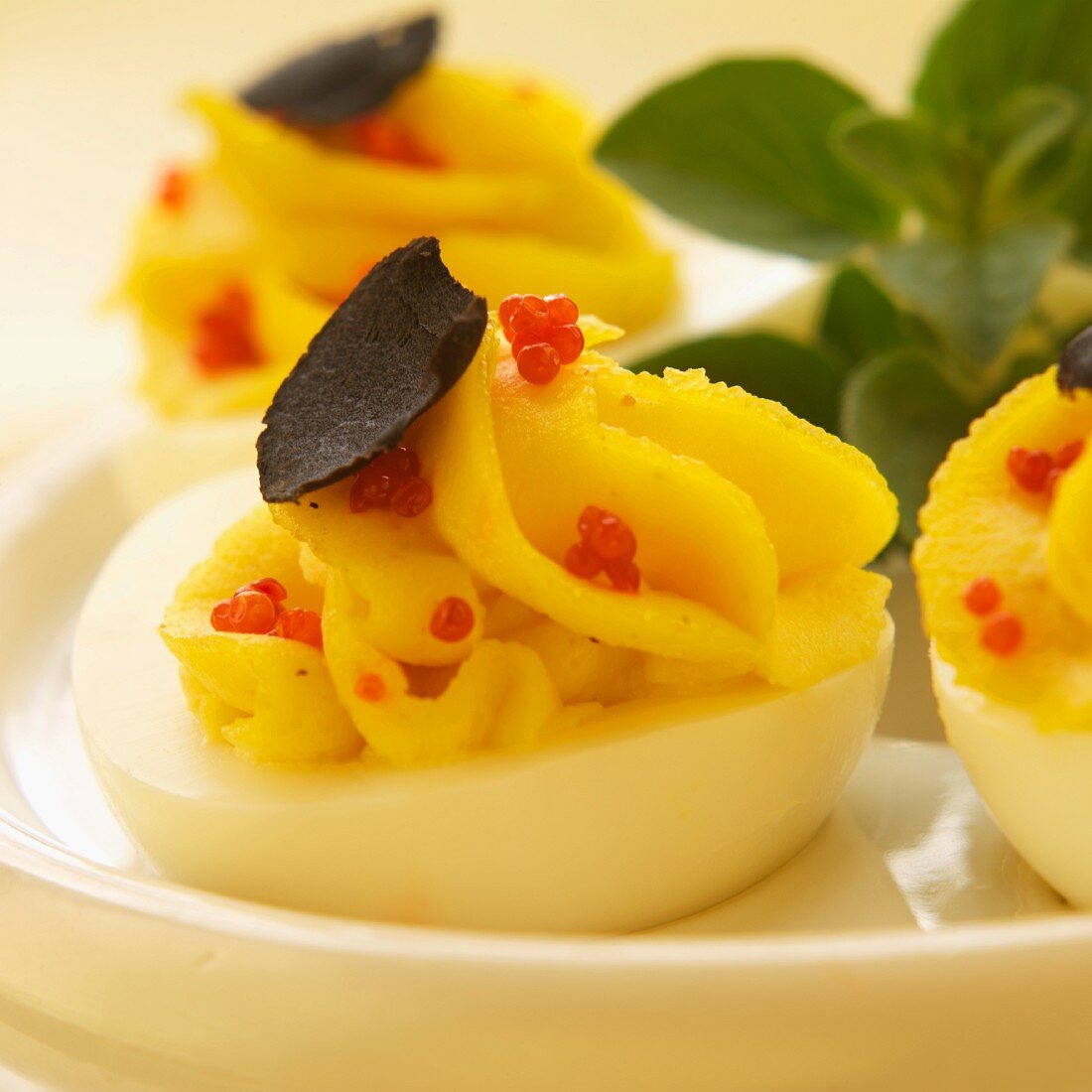 Deviled Eggs with Red Caviar and Truffle Mushroom Slices
