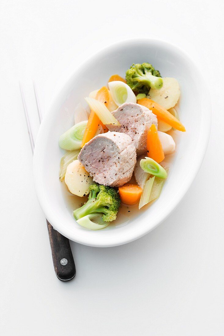 Poached pork fillet with leek, carrots and broccoli