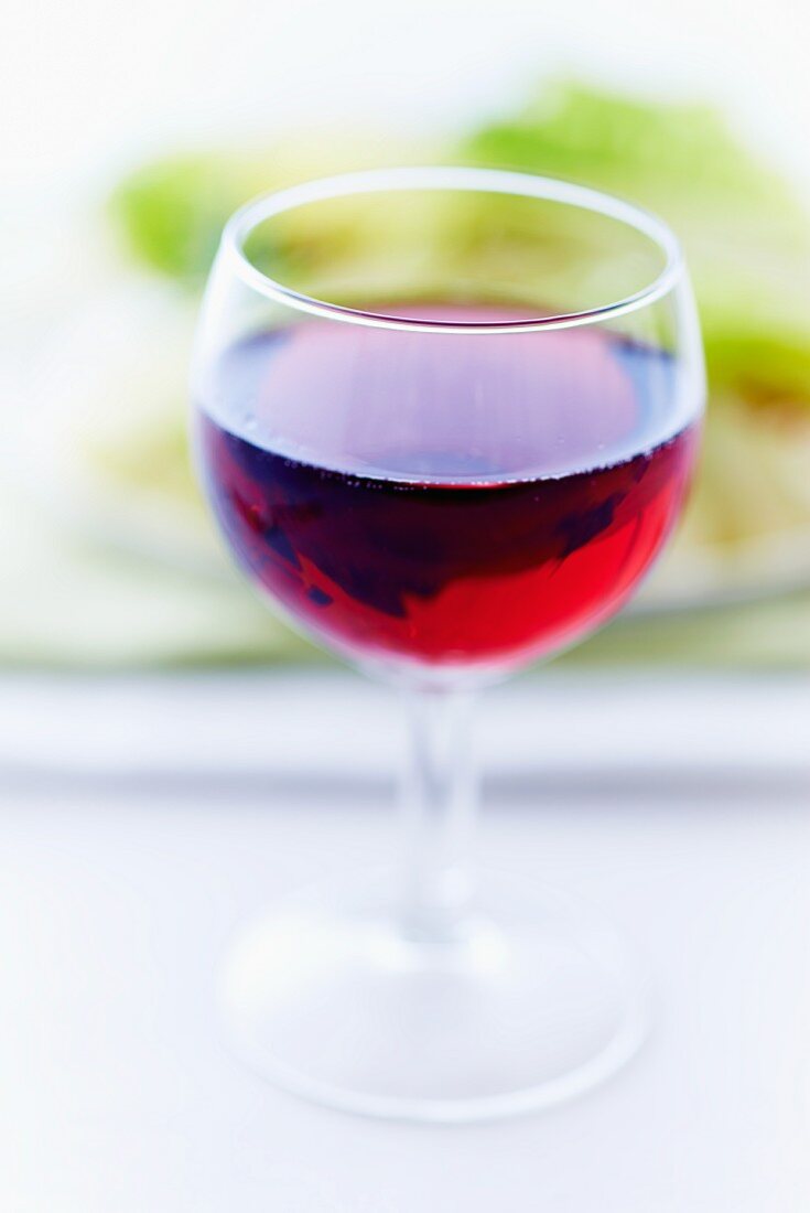 Glass of Red Wine on White Background