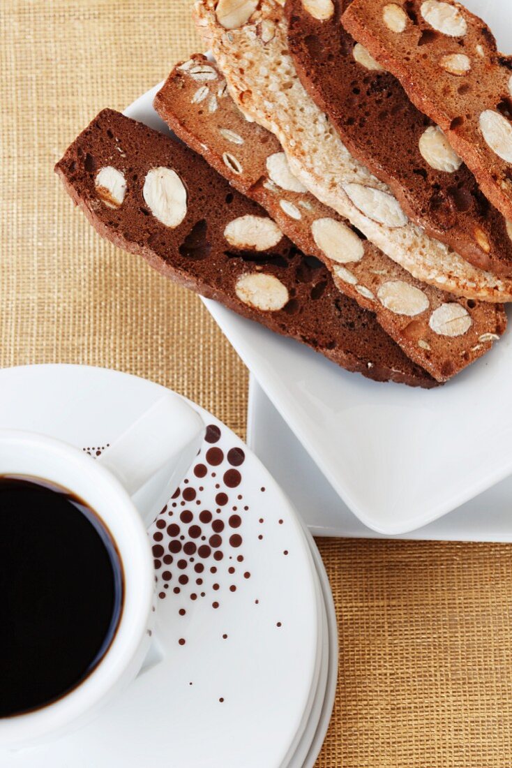 A cup of coffee and sweet almond toast slices