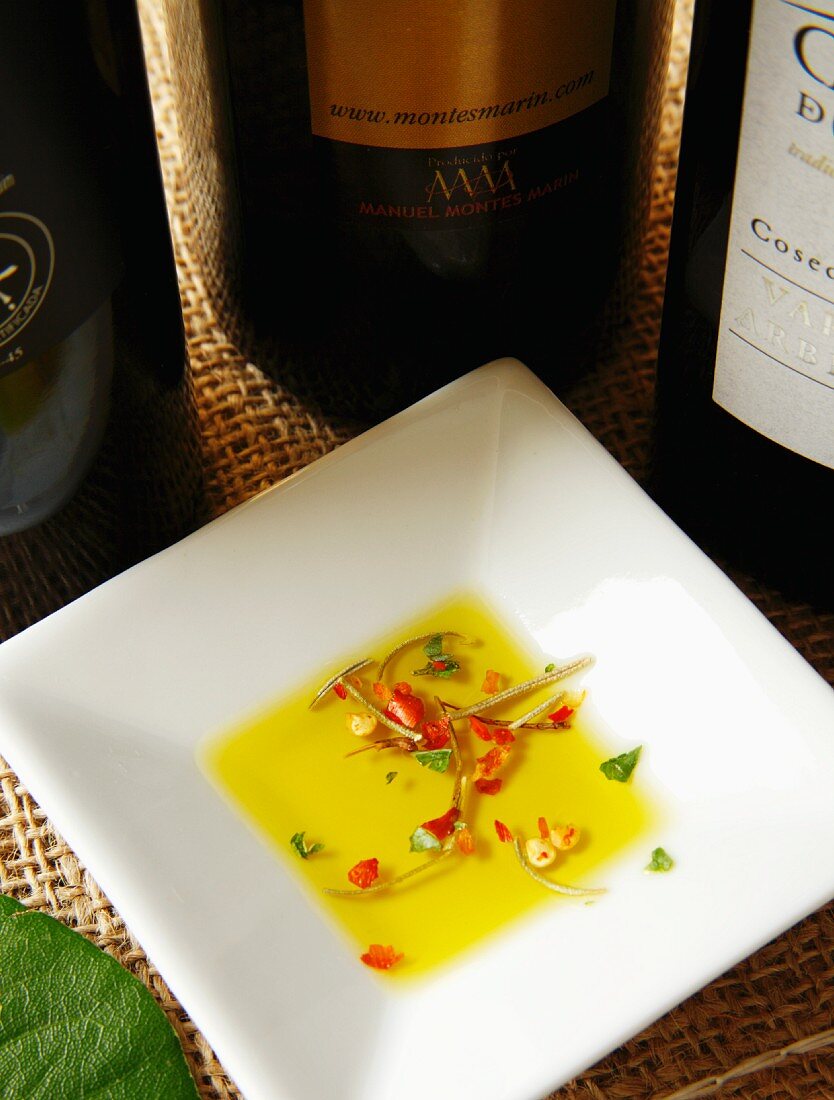 Small plate of olive oil and herbs