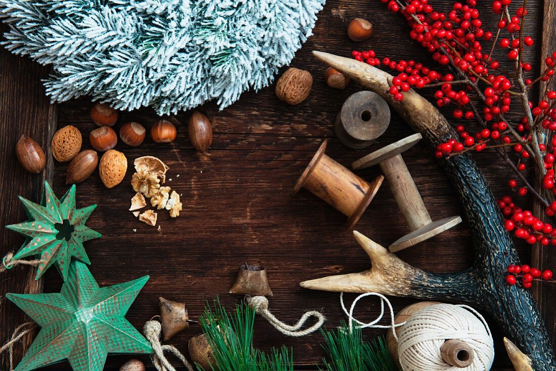 Various Christmas decorations (nuts, antlers, twigs of berries, stars)