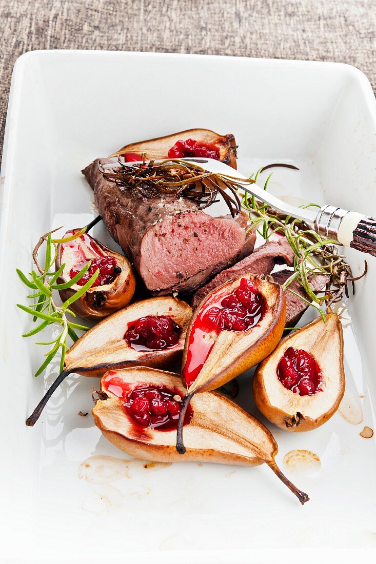 Venison fillet with baked pears and cranberries