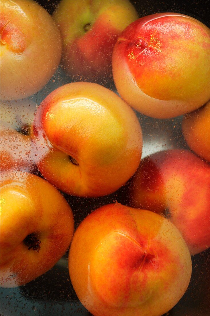 Fresh peaches in water