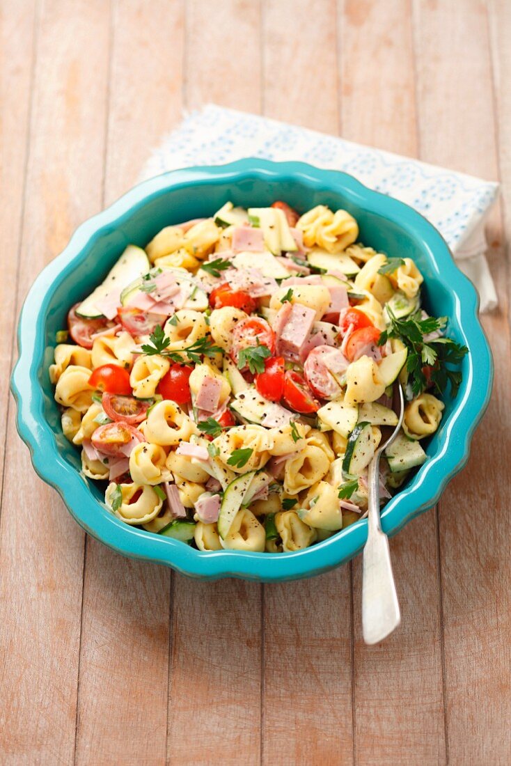 Tortellini salad with ham, tomatoes, cucumber and mayonnaise