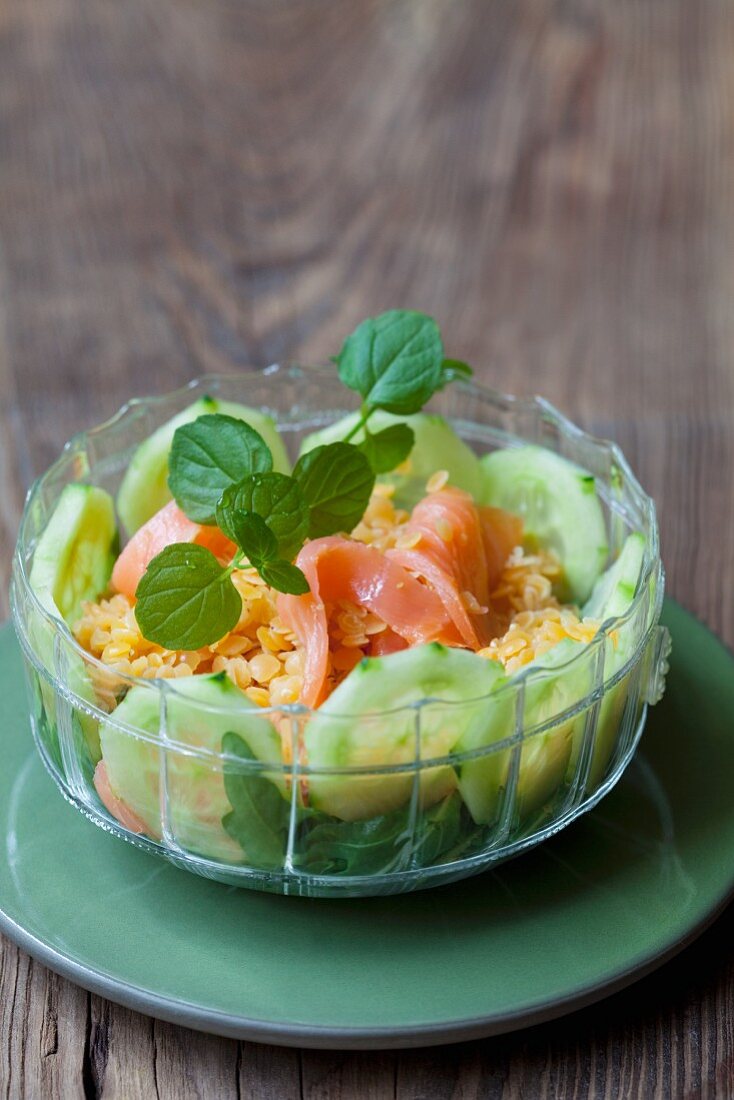 Lentil salad with smoked salmon, cucumber and rocket