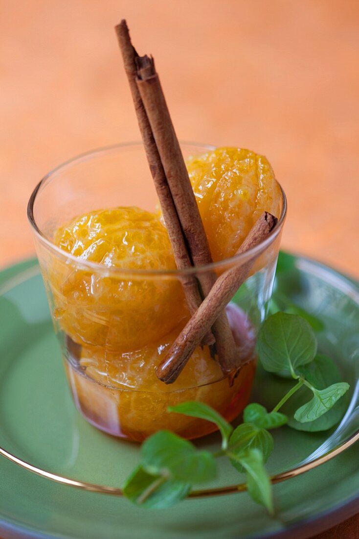 Caramelised clementines with cinnamon sticks
