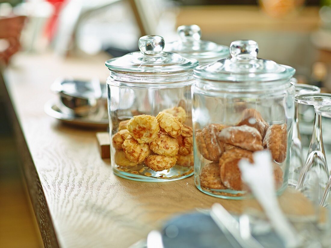 Almond biscuits in jars on the counter in a restaurant