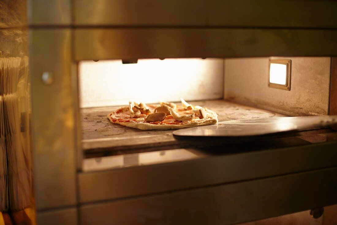 Pizza in a baking oven