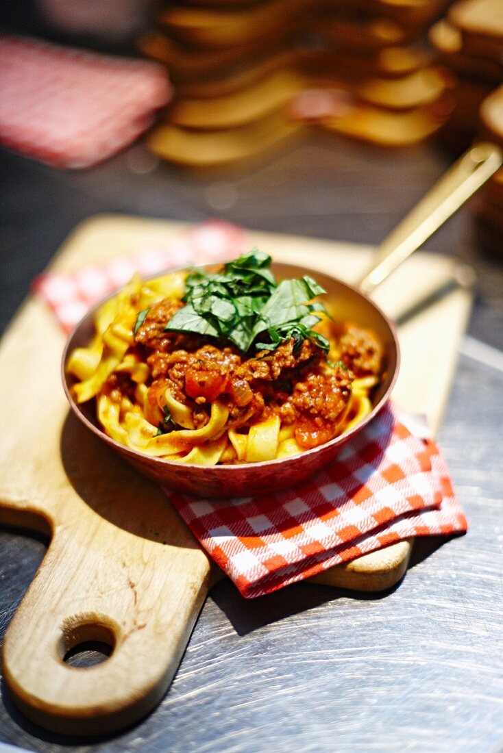 Ribbon pasta with minced meat sauce in a restaurant