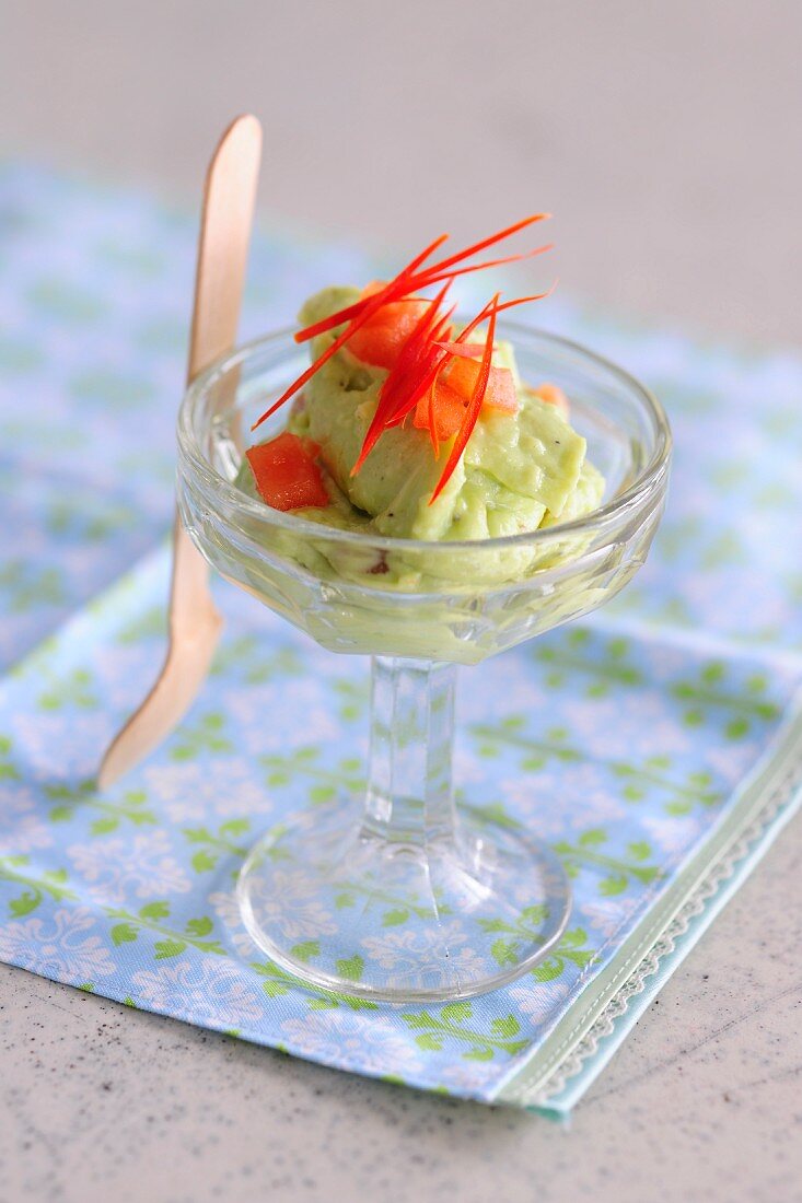 Classic Guacamole in a Glass Bowl; Fresh Avocados