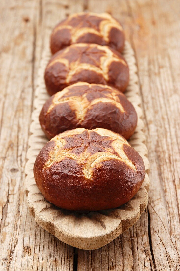 Four pretzel rolls in a row