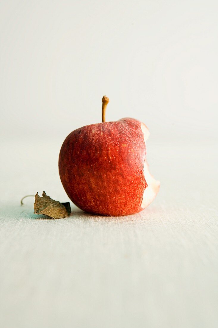 A Royal Gala apple, partly eaten